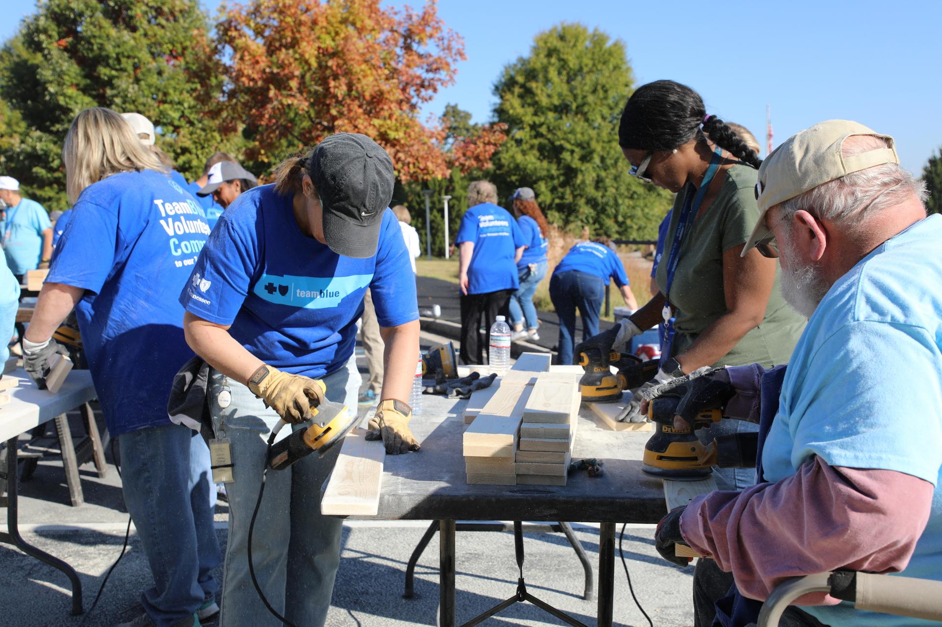 BlueCross volunteers assembling beds