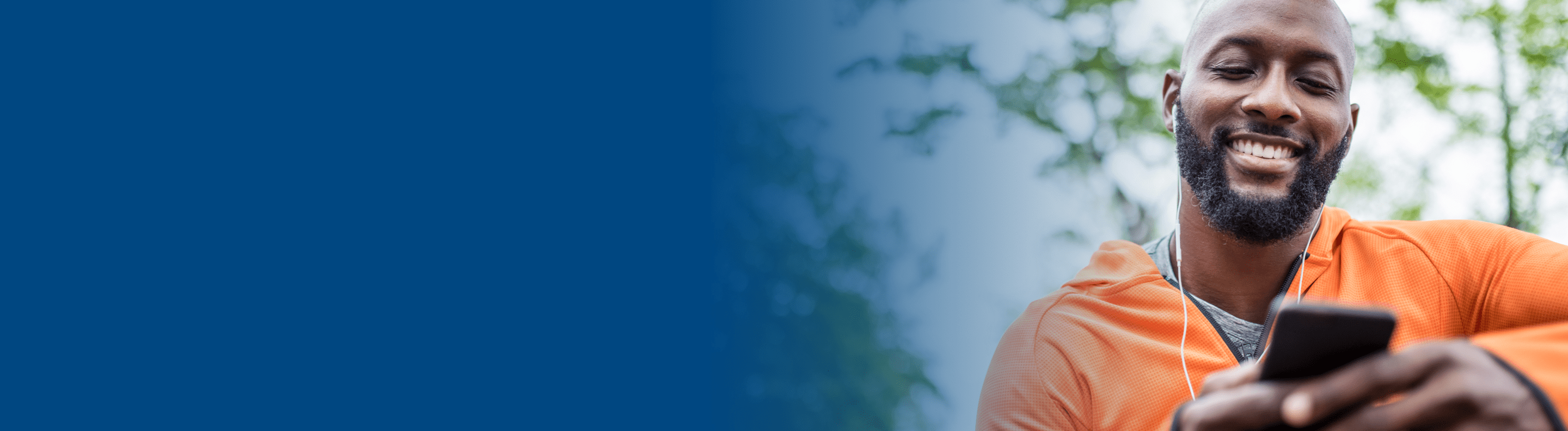 Man looking at BCBSTN mobile app on phone Man looking at BCBSTN mobile app on phone