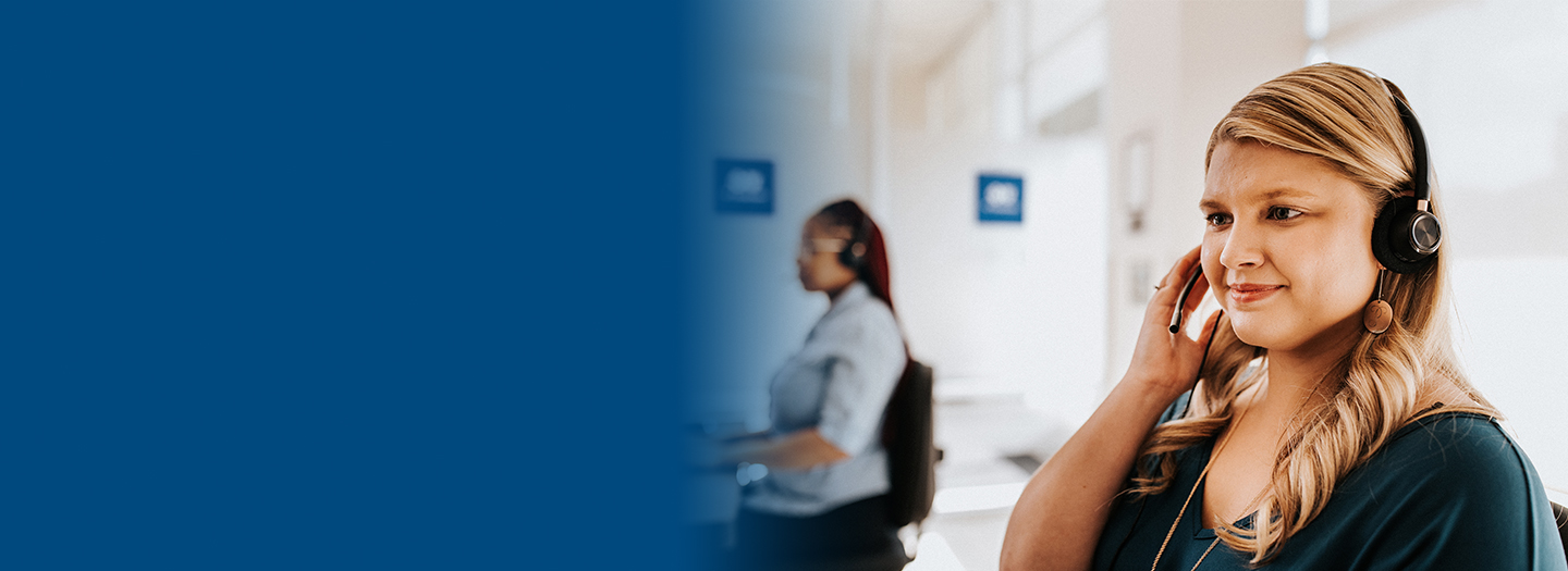 Woman working and talking through a headset. Woman working and talking through a headset.
