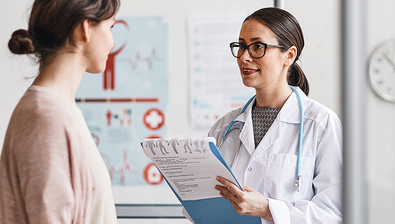 Patient and doctor interacting in office setting