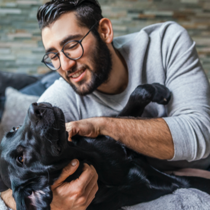 Man playing with dog