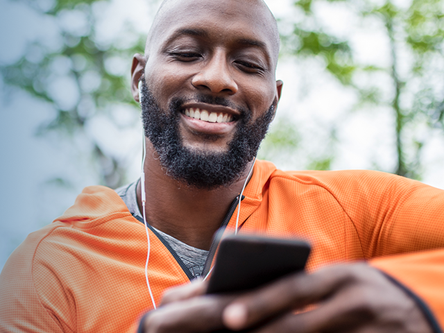 Man looking at BCBSTN mobile app on phone Man looking at BCBSTN mobile app on phone