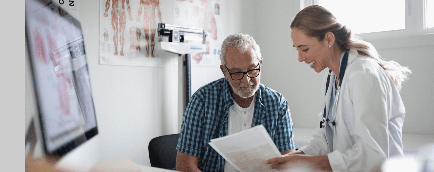 Older man consulting with his physician