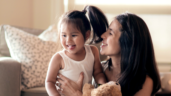 Young mother smiling at her young daughter Young mother smiling at her young daughter
